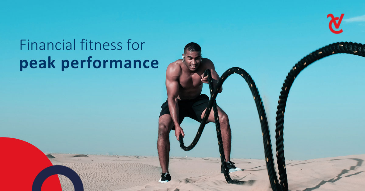 A man exercising with battle ropes in the desert. 