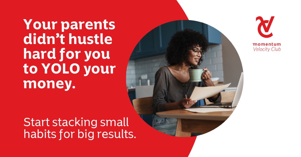 A young woman seated at a table in front of her laptop learning how habit stacking can positively impact her financial success.