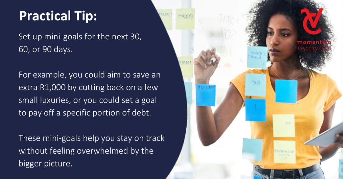  A woman writing down her mini goals on Post-it notes.
