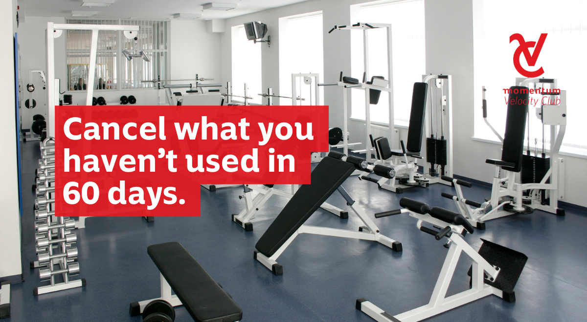 Gym equipment sits unused in an empty gym.